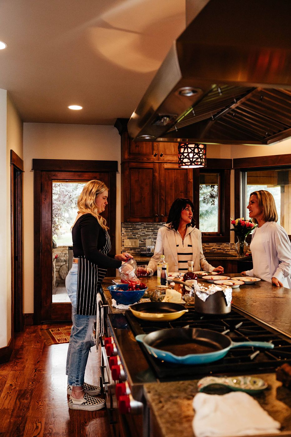 Campbell teaching a small group in a home kitchen