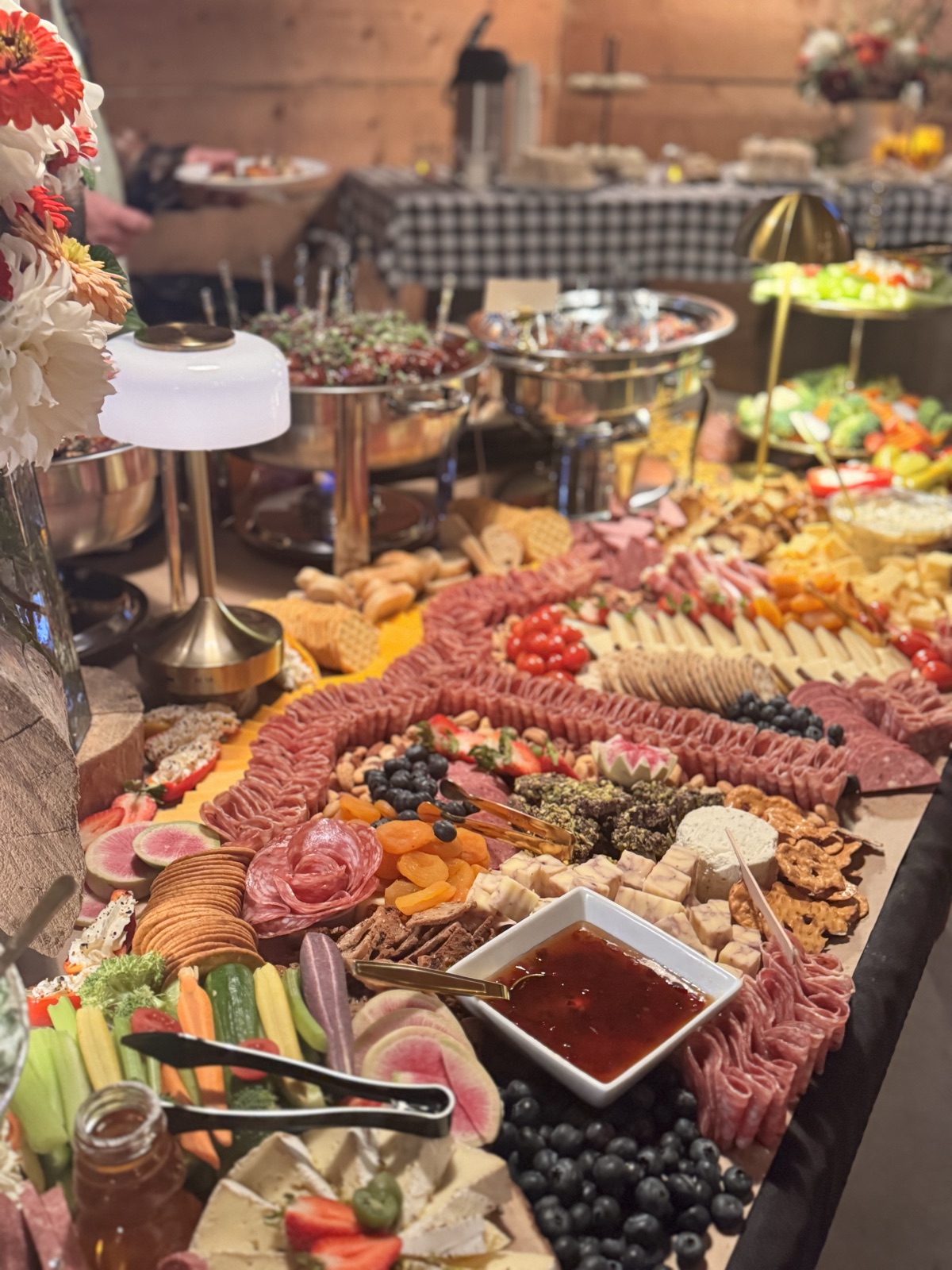 Charcuterie table with cured meats, cheeses, and fruit