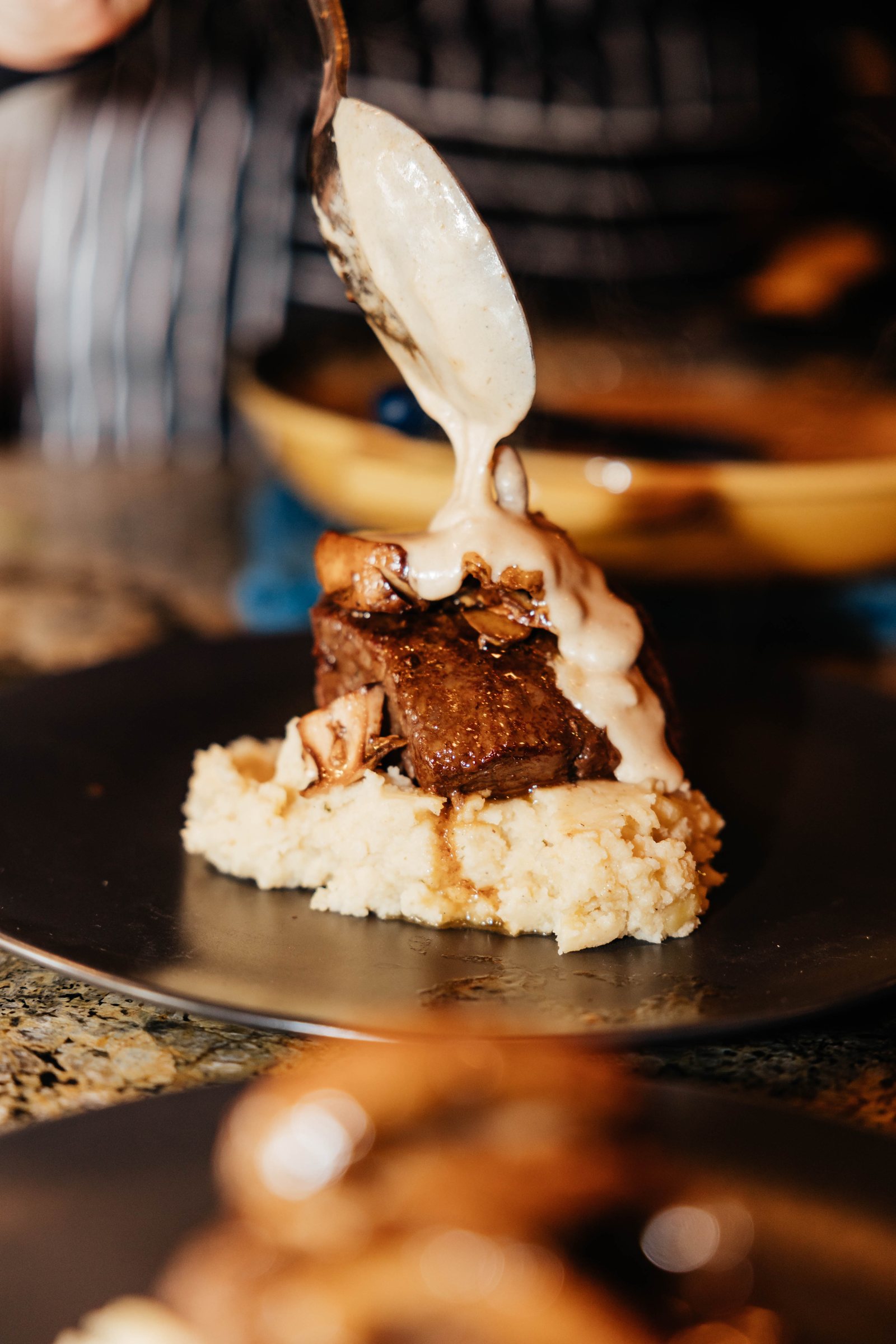 Sauce poured over a filet just before it is served